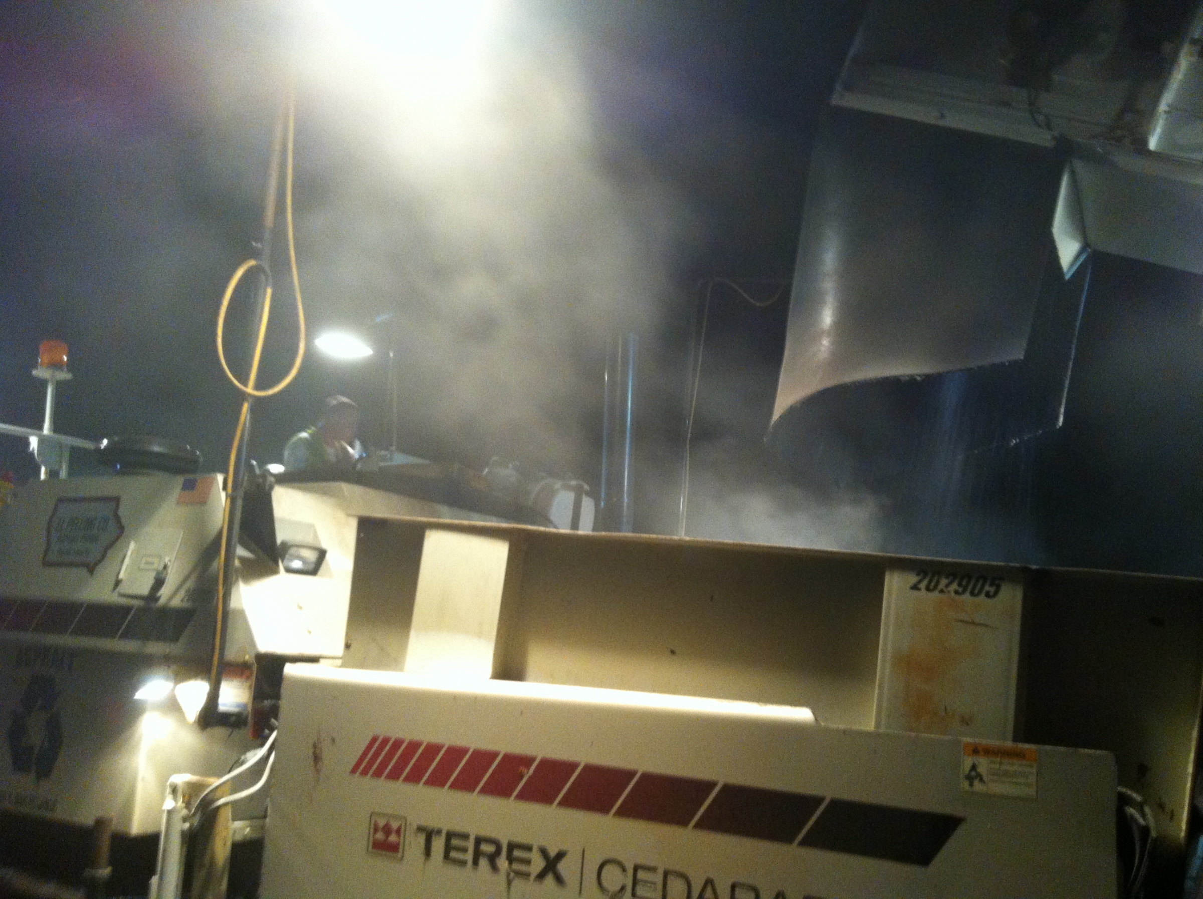 Hot Mix Asphalt being poured with lots of fumes coming off